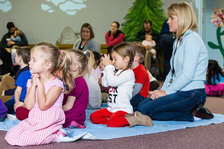 Preschoolers and teacher at chapel time